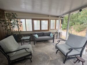 Photo of chairs on a porch.
